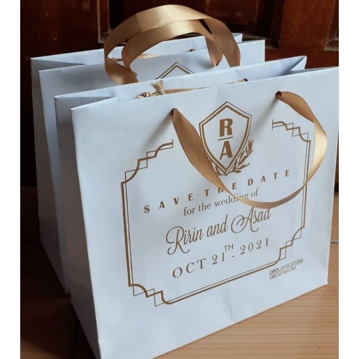 

TAS PUTIH GLOSSY CETAK EMAS / TAS PROMOSI / TAS SOUVENIR /TAS KOTAK NASI