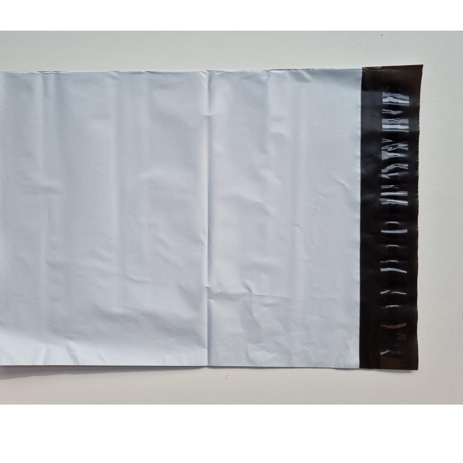 

Grosir POLYMAILER ±100PCS 17x30CM PUTIH PREMIUM GLOSSY PLASTIK POLYMAILER WHITE D69 ➠