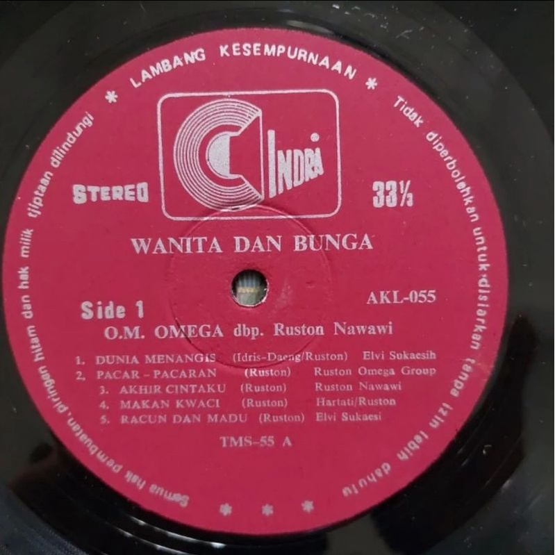 Kaset Vinyl Piringan Hitam Omega Grup - Elvi Sukaisih.Wanita dan Bunga