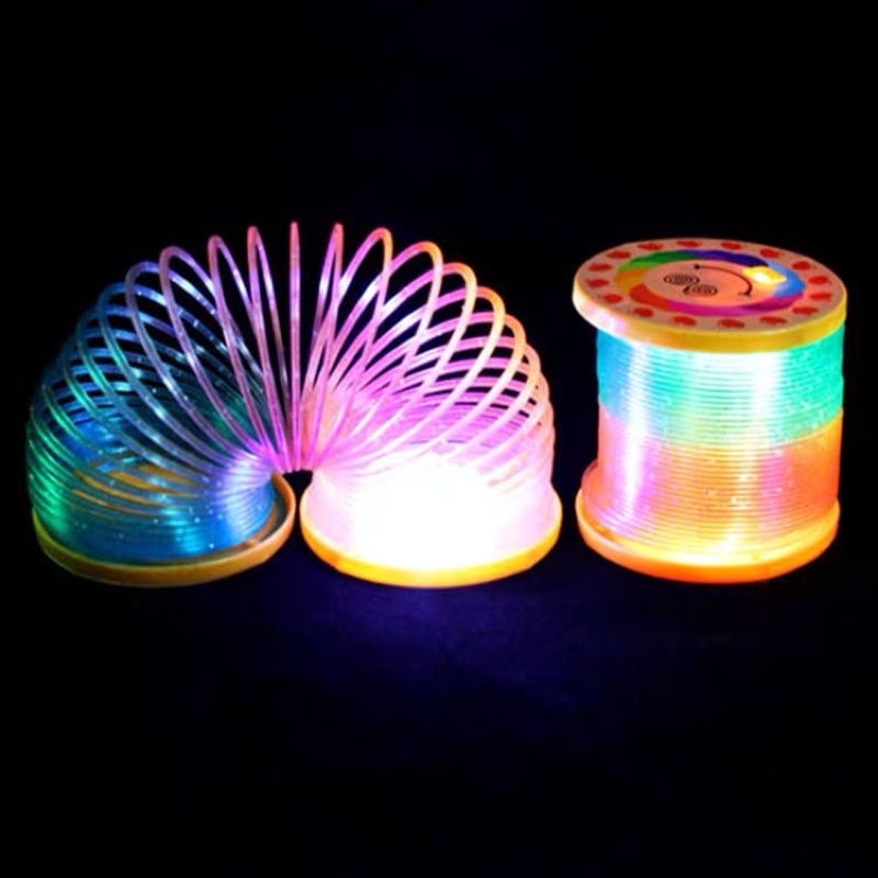 Mainan Spring Slinky Magic Warna Pelangi Ada Lampu