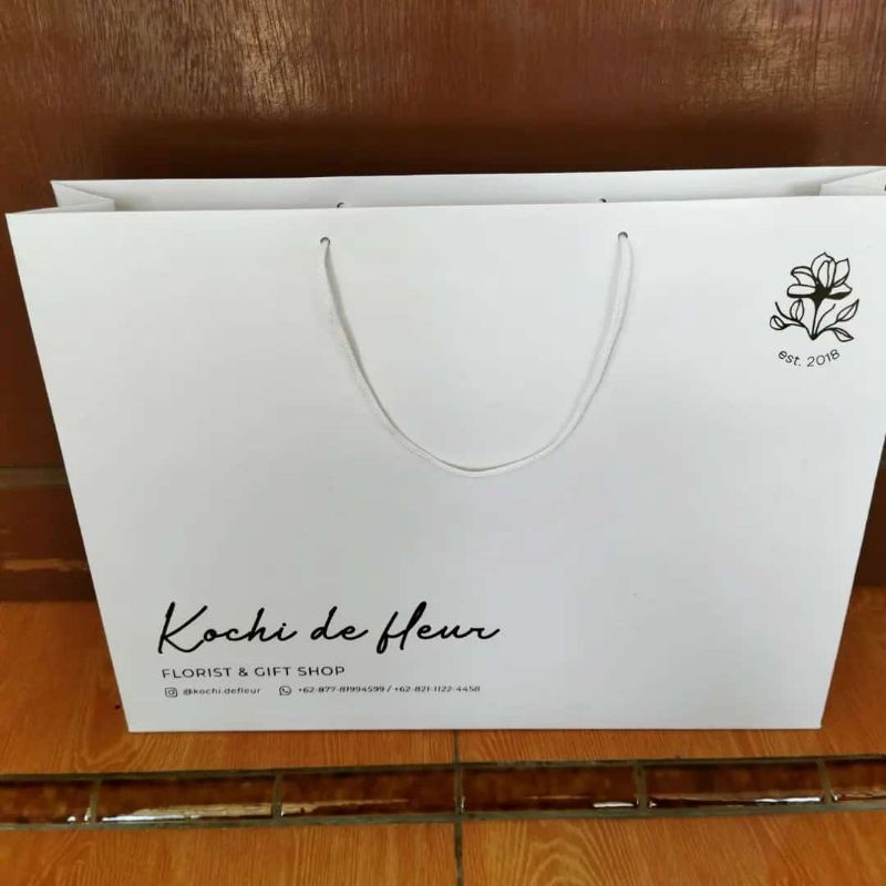 

paperbag custom ,ivory glosy 210 gr. size 55*15*45