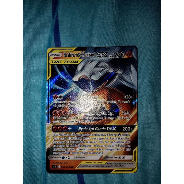 kartu pokemon reshiram & charizard gx tag team tcg indonesia