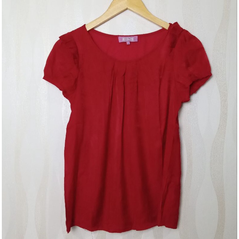 Atasan solemio merah