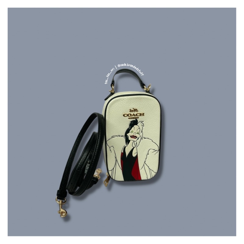 TAS SLING HANDPHONE BRANDED WANITA COACH CC328 DISNEY CRUELLA EVA PHONE XBODY ORIGINAL ZADABRANDEDST