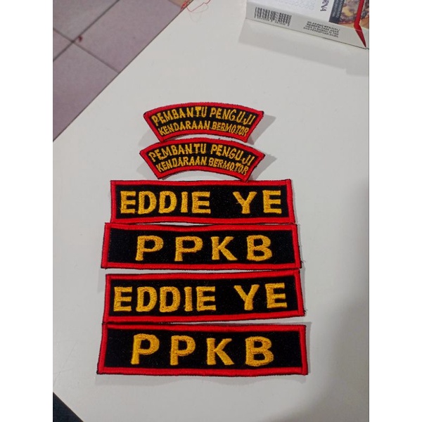 bordiran nama:sekolah,satpam, polisi,TNI dll