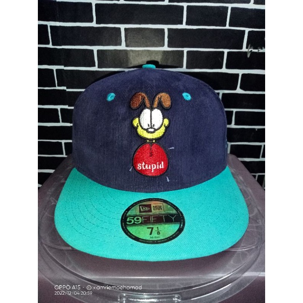 Topi snapback newera x garfield second