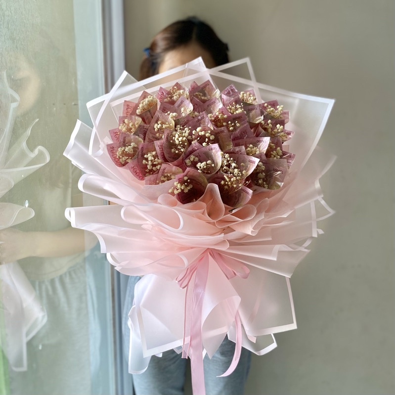 money buket 100 sebanyak 25 lembar