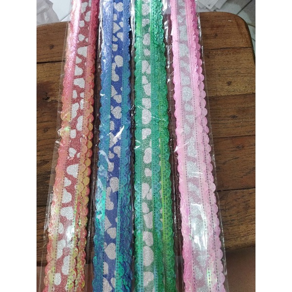 

Pita tarik 50074 gelombang glitter panjang 45 cm aneka warna per pack isi 10