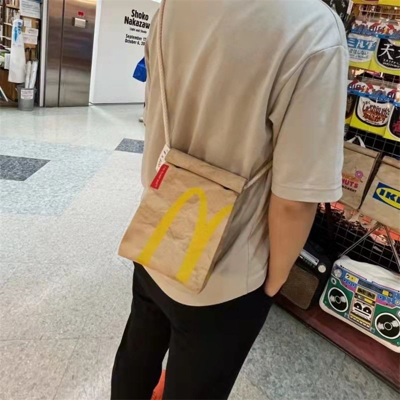 ℗Sera McDonald s schoolbag paper bag backpack women s backpack tas berkapasitas besar mahasiswa kelas rekreasi buku merah kecil dengan paragraf yang sama