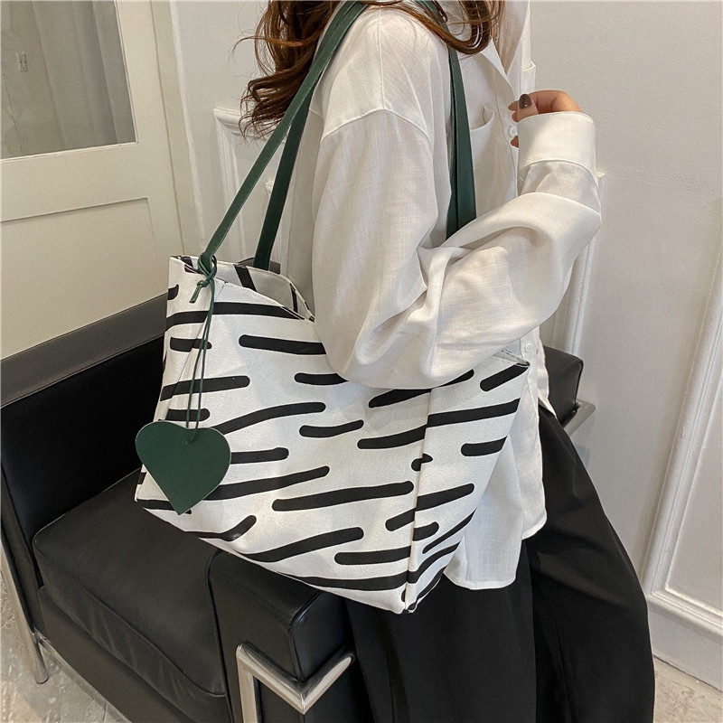 ❐☇﹊Sera Niche High-End Zebra Pola Kanvas Tas Wanita 2022 Baru Kapasitas Besar Tote Tas Siswa Tas Bahu