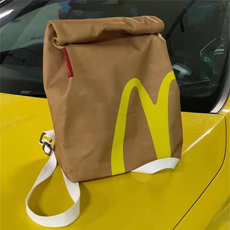 ▧Sera McDonald s schoolbag paper bag backpack women s backpack tas berkapasitas besar mahasiswa kelas rekreasi buku merah kecil dengan paragraf yang sama