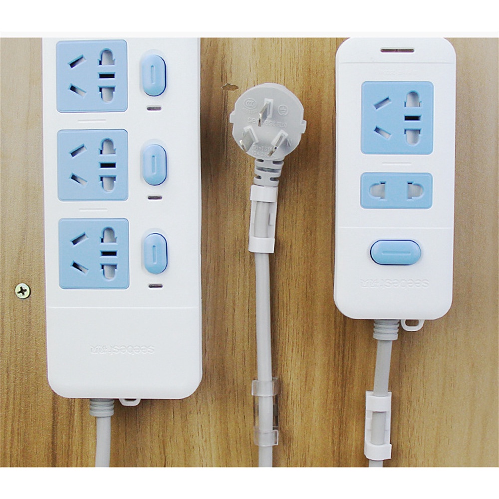 ღ Self-Adhesive Socket Fixer Kuku Gratis Plug Rak Pemegang Dinding Plug Stiker Sucker Tanpa Jejak Socket penyimpanan Rumah Organizer Kabel Rak