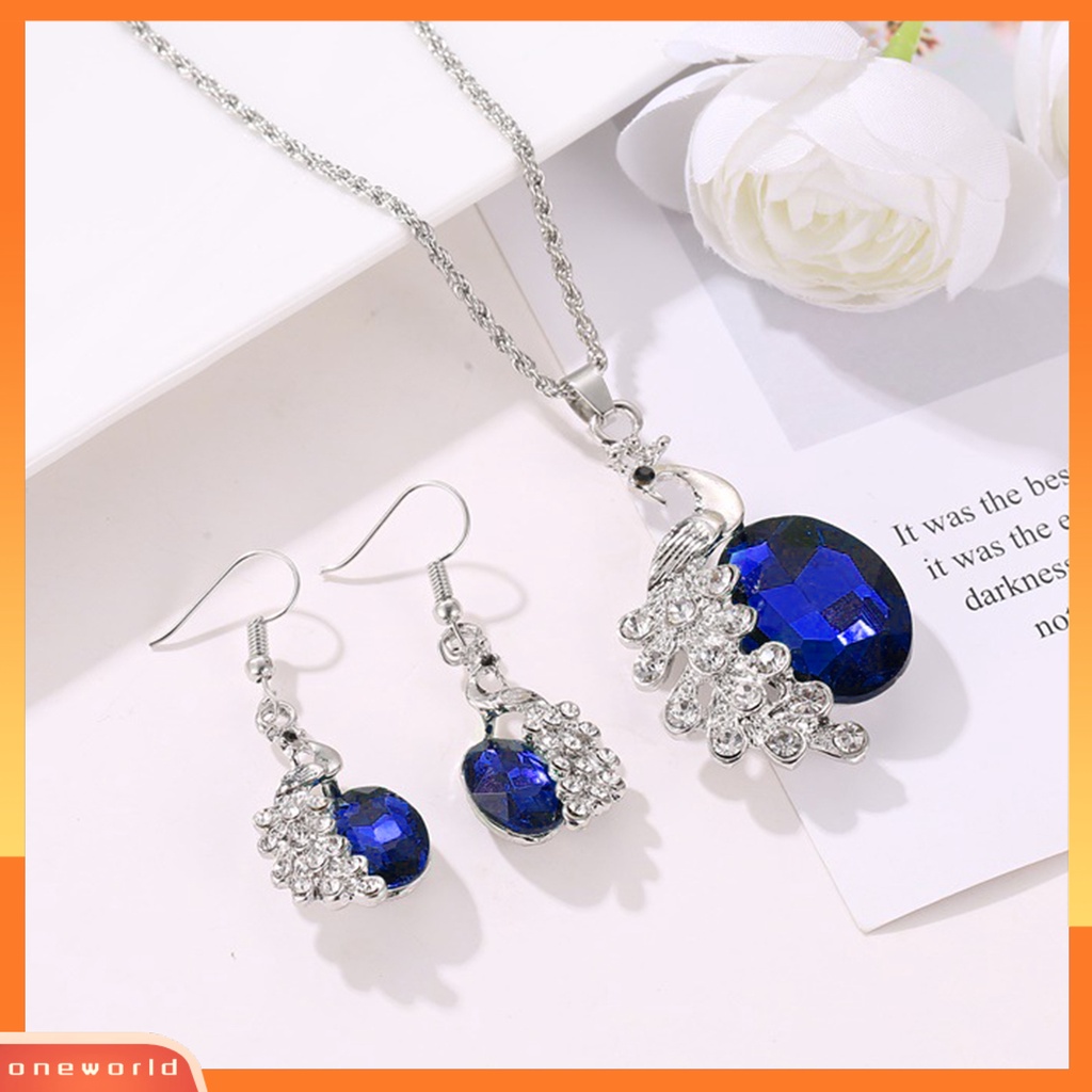 [ONE] 2pcs/set Kalung Anting Set Biru Kristal Imitasi Kepribadian Glitter Indah Bentuk Merak Hias Berlian Imitasi Liontin Anting Kalung Perhiasan Aksesori