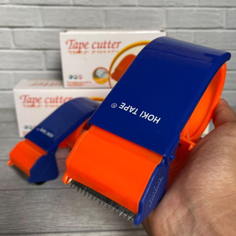 

ROLLAN DISPENSER HOKI ALAT PEMOTONG LAKBAN PLASTIK BAGUS