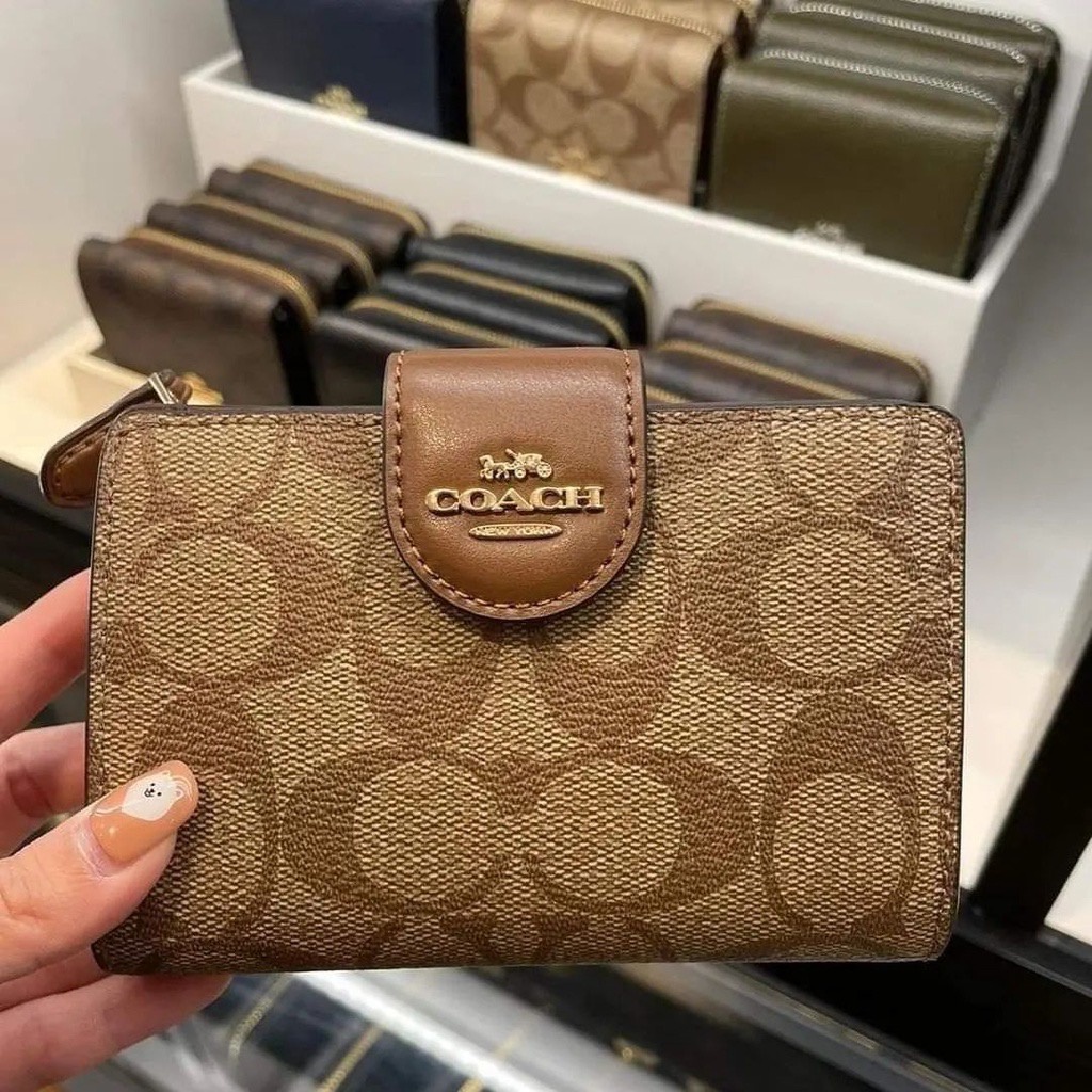 Dompet kartu lipat merek coach
