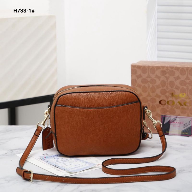 co@ch camera in signature crosbody