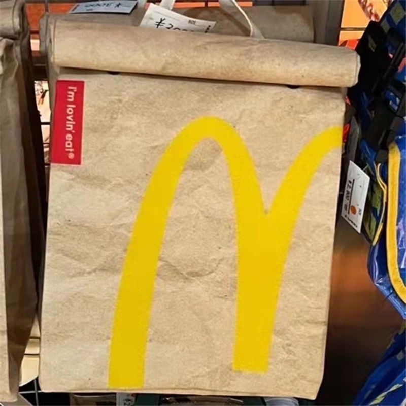 ℗Sera McDonald s schoolbag paper bag backpack women s backpack tas berkapasitas besar mahasiswa kelas rekreasi buku merah kecil dengan paragraf yang sama