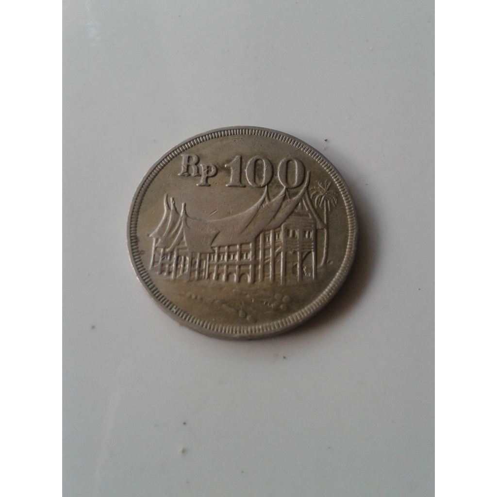 uang koin logam tebal Rp.100 tahun `1971 rumah gadang