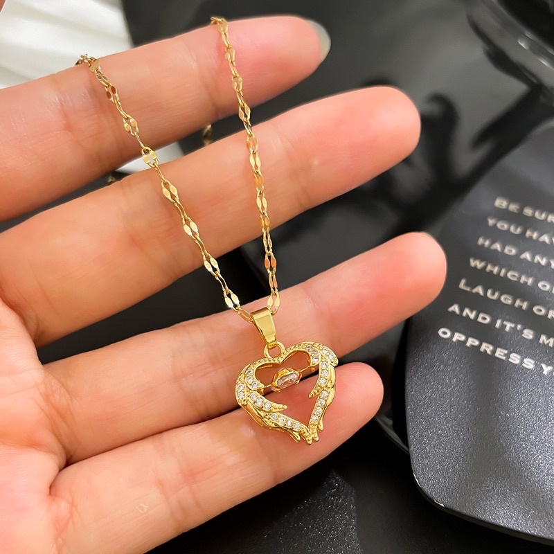 kalung hati titanium asli dancing stone