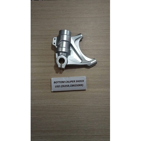 BOTTOM CALIPER SHOCK USD