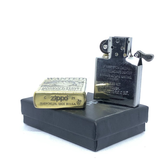 Korek Zippo Gold Motif One Piece Luffy Wanted Gold Grafir