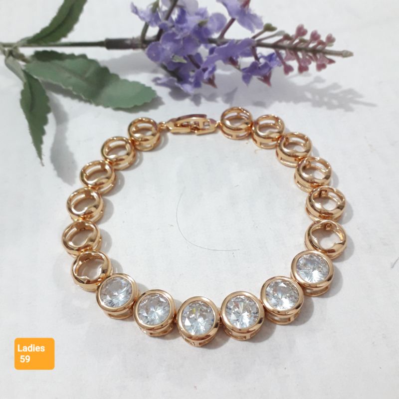 Gelang permata manik putih warna emas dewasa.