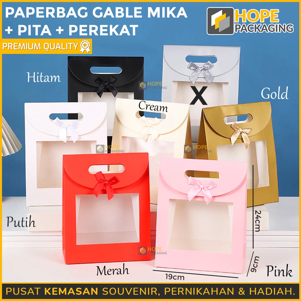 

Paper Bag Gable Mika Polos + Pita + Perekat Size : 24x19x9 cm/ Tas Kado Transparan Polos/ Paper Bag Ultah/ Tas Hampers Mika/ Tas Jinjing Valentine/ Kotak Kado Pita/ Packing Valentine