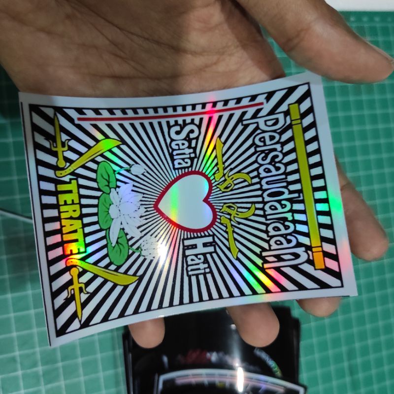 Stiker PSHT isi 8 hologram/pelangi anti luntur