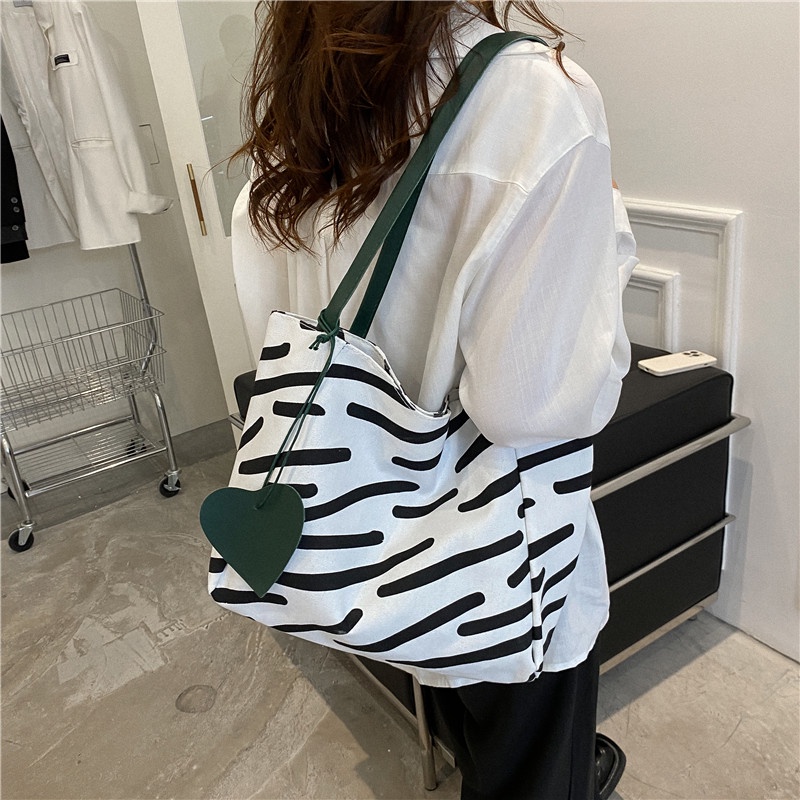 ❐☇﹊Sera Niche High-End Zebra Pola Kanvas Tas Wanita 2022 Baru Kapasitas Besar Tote Tas Siswa Tas Bahu