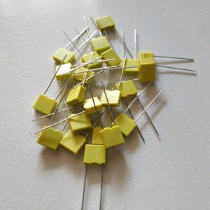 CAPASITOR MKM 103 100V KUNING stok tersedia