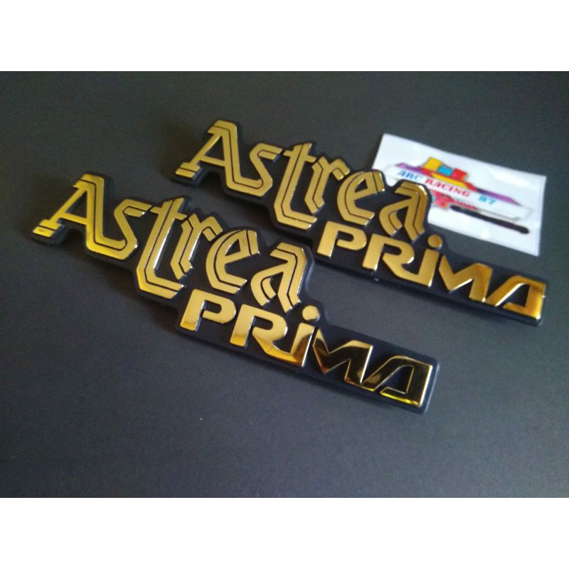 EMBLEM LOGO TUTUP ACCU ASTREA PRIMA