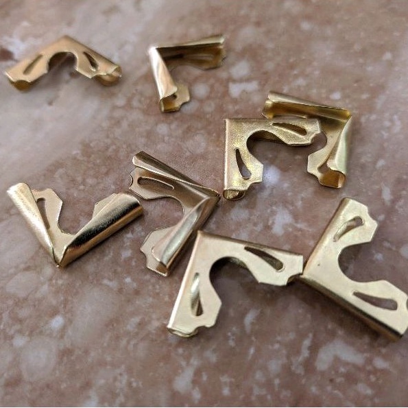 Pengaman pojokan kitab / pojokan kitab