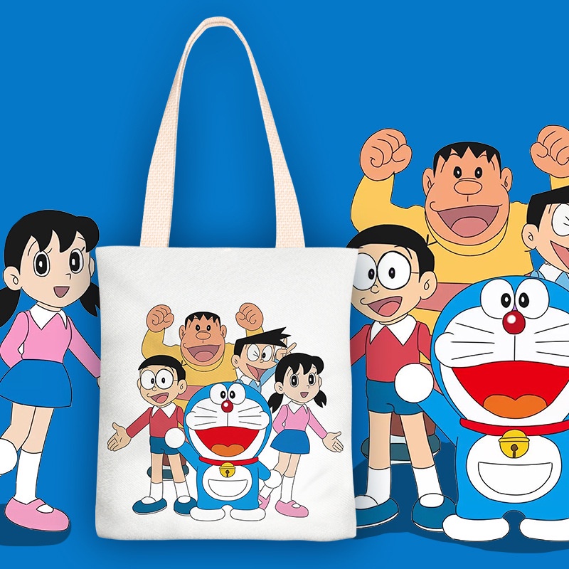 ♟✌☽Sera Doraemon Tas Kanvas Wanita Tas Bahu Tunggal Portabel Kapasitas Besar Anak Siswa Kelas Tas Gadis 2022 Musim Gugur dan Musim Dingin