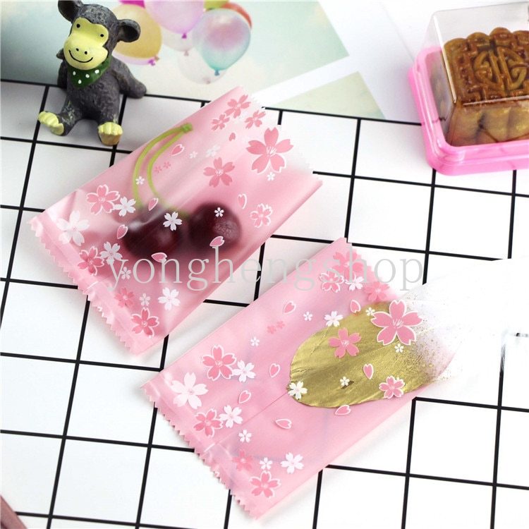 100pcs / set Kantong Kemasan Kue / Permen / Biskuit Motif Bunga Sakura Pink Ukuran 7x10cm Untuk Pesta