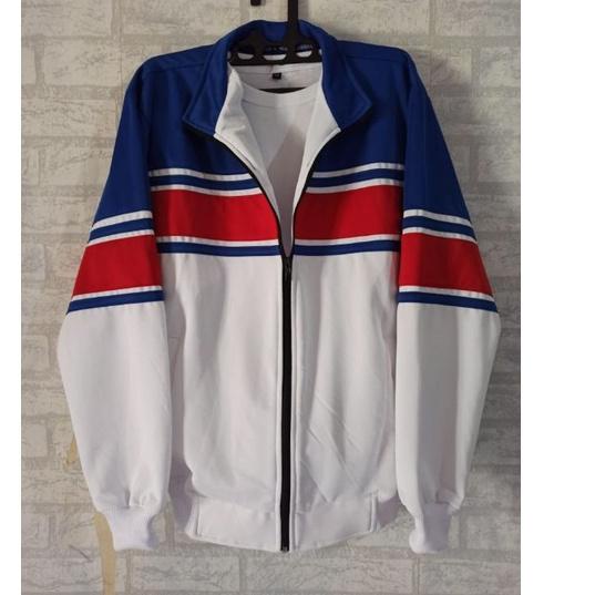 ➢ jaket traktop biru/ putih Lis merah ➤