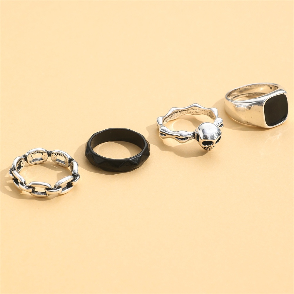 Tren Fashion Hitam Tua Gaya Set Cincin Hitam Drip Rantai Cincin Tengkorak Kepala Perlindungan Lingkungan Alloy Ring 4buah