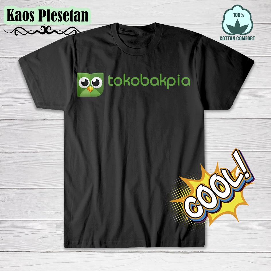 Kaos plesetan merk tokopedia