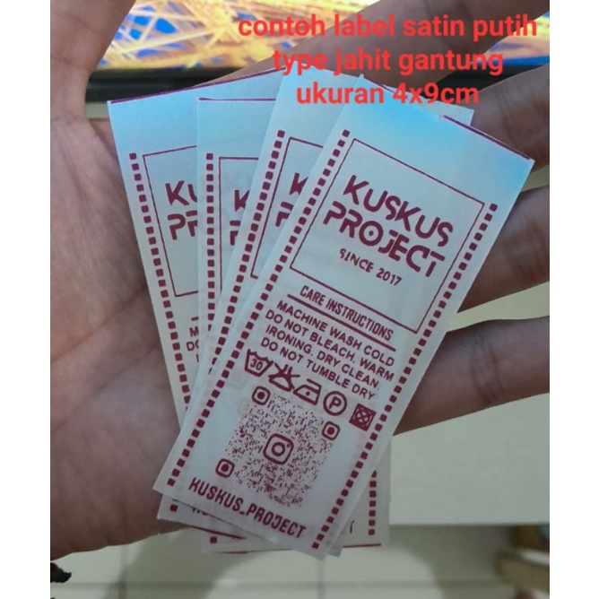 

label baju custom satin putih 4cm harga per lusin