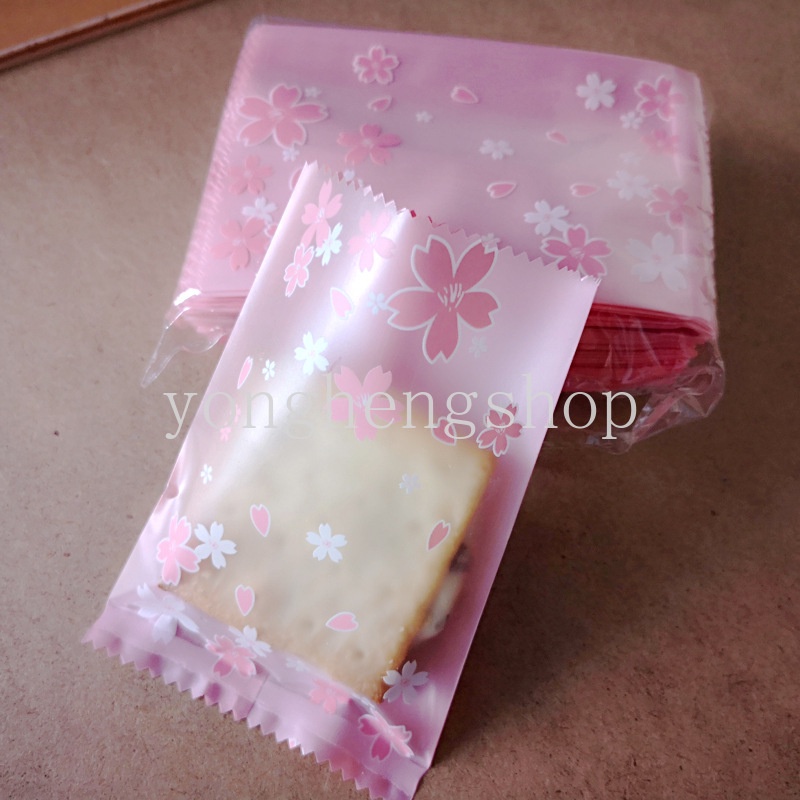 100pcs / set Kantong Kemasan Kue / Permen / Biskuit Motif Bunga Sakura Pink Ukuran 7x10cm Untuk Pesta