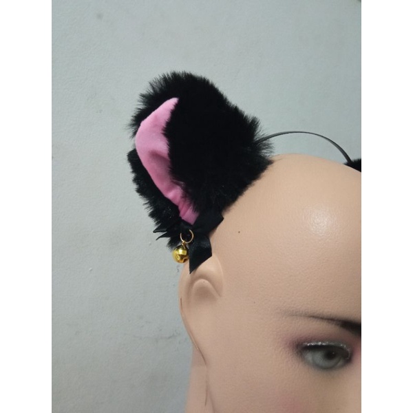 bando kuping kucing lonceng bulu