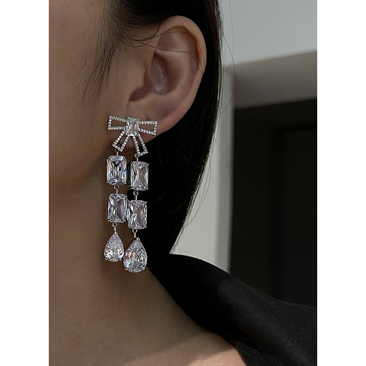 Goldkingdom Aksesoris Perhiasan Fashion Ready Stock Niche Desain Eropa Dan Amerika Serikat Suasana Busur Menetes Penuh Bor Wanita Giwang Anting Panjang