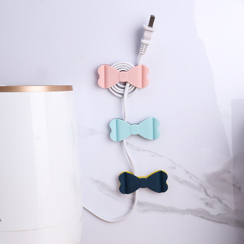 Portable PP Self-adhesive Bow Tie Shape Cord Winder/Dipasang Di Dinding Tanpa Meninju Pengisian Kawat Plug Tetap Rak/Peralatan Rumah Tangga Klip Penyimpanan Kabel