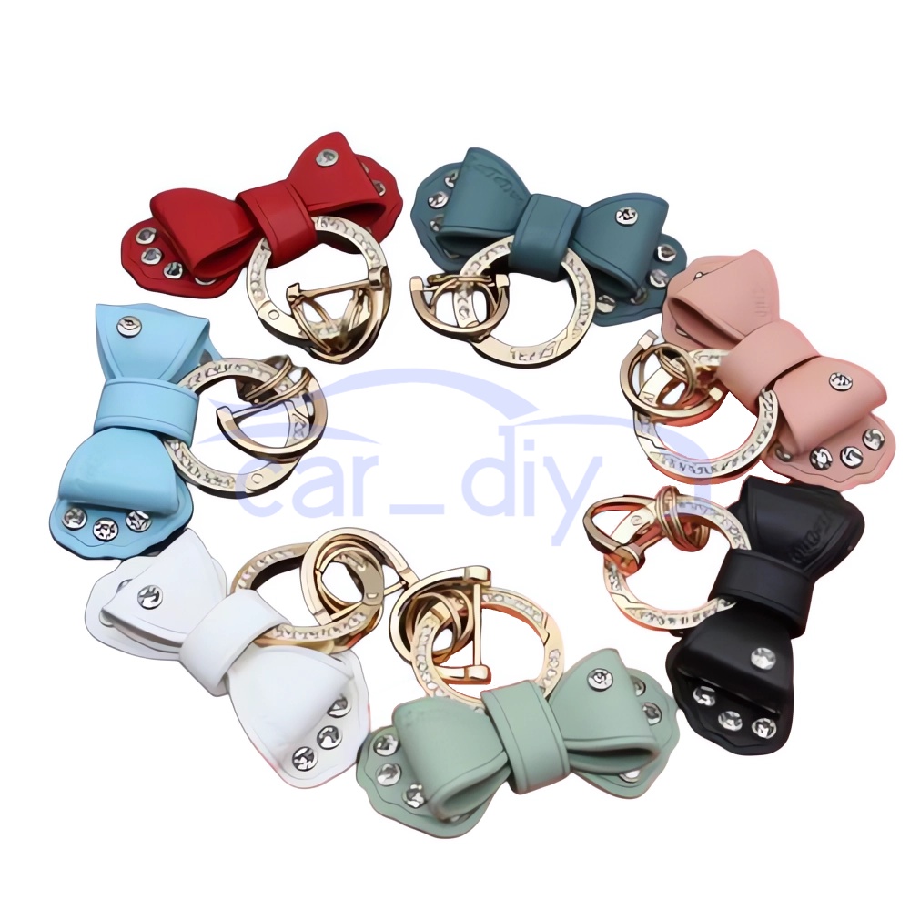 Gantungan Kunci Bentuk Pita Bahan Metal Cincin Berlian Imitasi Warna Emas Untuk Pria / Wanita