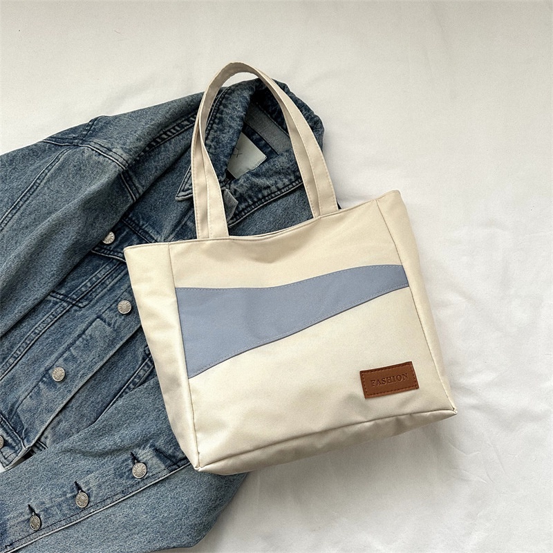 Tas wanita import berkualitas harga grosir bisa cod Kain Oxford kapasitas besar tas santai 2023 musim semi dan musim panas gaya baru tahun ini fashion satu bahu tas ketiak tas ember