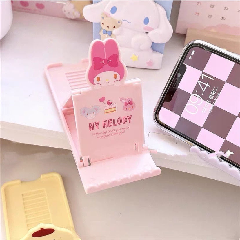 Kuromi Kartun Phone Holder Cinnamoroll Berlubang Desktop Lazybone Phone Holder Base Desktop Ornamen Hias Dapat Dilipat Holder