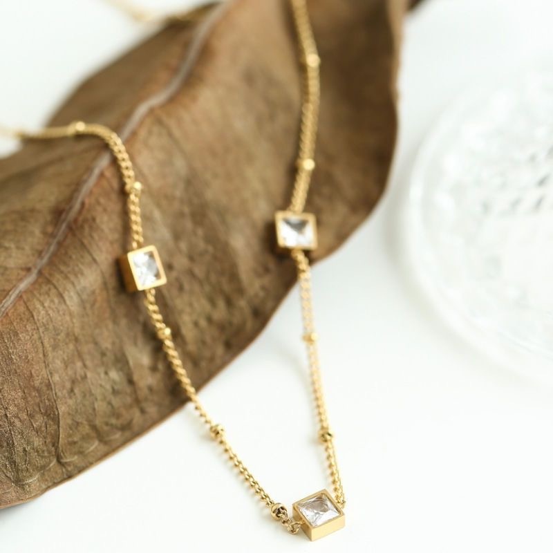 Kalung tiga zircon  titanium stainless steel 316L import anti karat harga grosir bisa cod