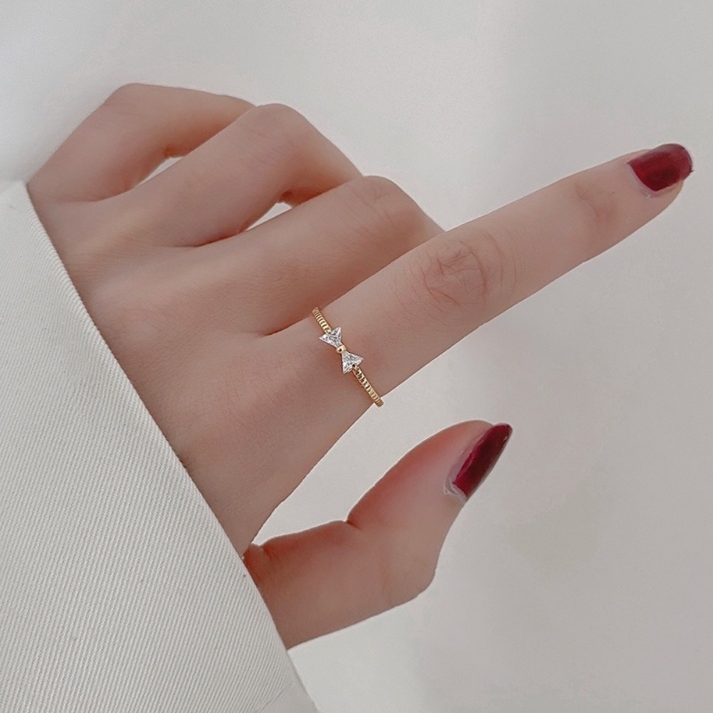 Cincin Tembaga Lapis Emas Desain Pita Hias Zircon Untuk Wanita