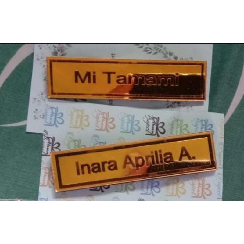 

nama dada akrilik mirror gold grafir