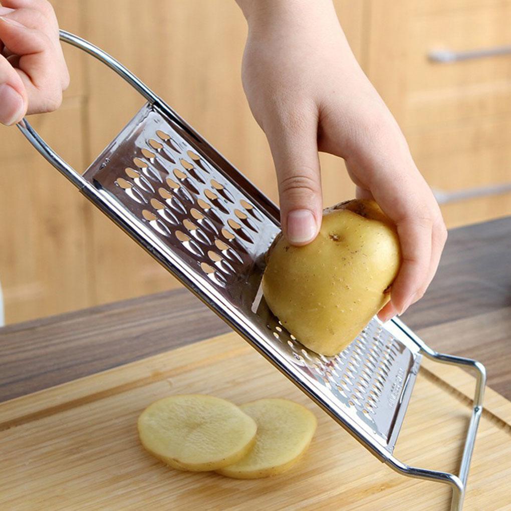 Parutan Makanan Stainless Steel Multifungsi Nonslip Genggam Dengan Pengait Pengupas Kentang Pengikis Tahan Karat Chopper Sayur