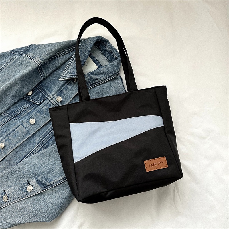 Tas wanita import berkualitas harga grosir bisa cod Kain Oxford kapasitas besar tas santai 2023 musim semi dan musim panas gaya baru tahun ini fashion satu bahu tas ketiak tas ember